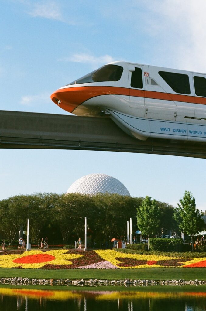 Photo by Juliana Uribbe A monorail train on a bridge over a lake